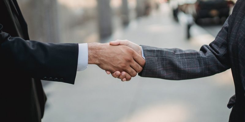 close up of business people shaking hands