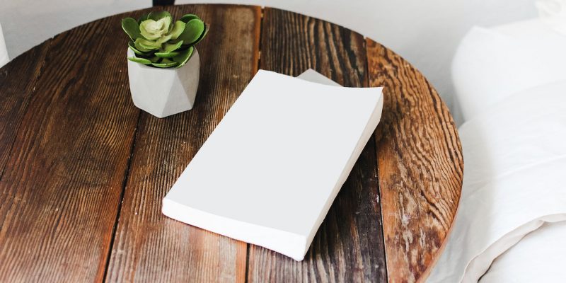 white book on brown round table
